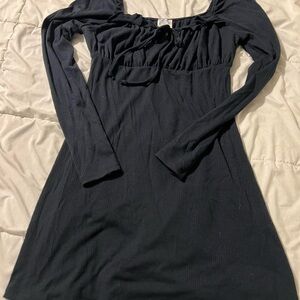 Black dress with ruffled details from Francesca’s brand blue raine.